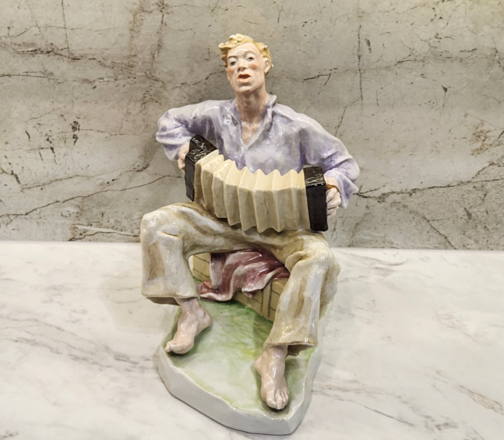 Decorative Figurine of a Boy, Handcrafted Ceramic Sculpture