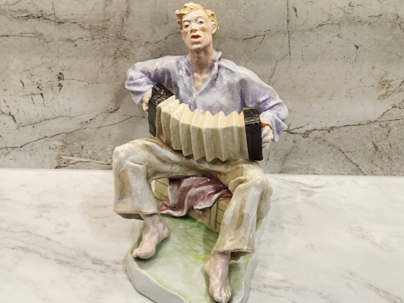 Decorative Figurine of a Boy, Handcrafted Ceramic Sculpture